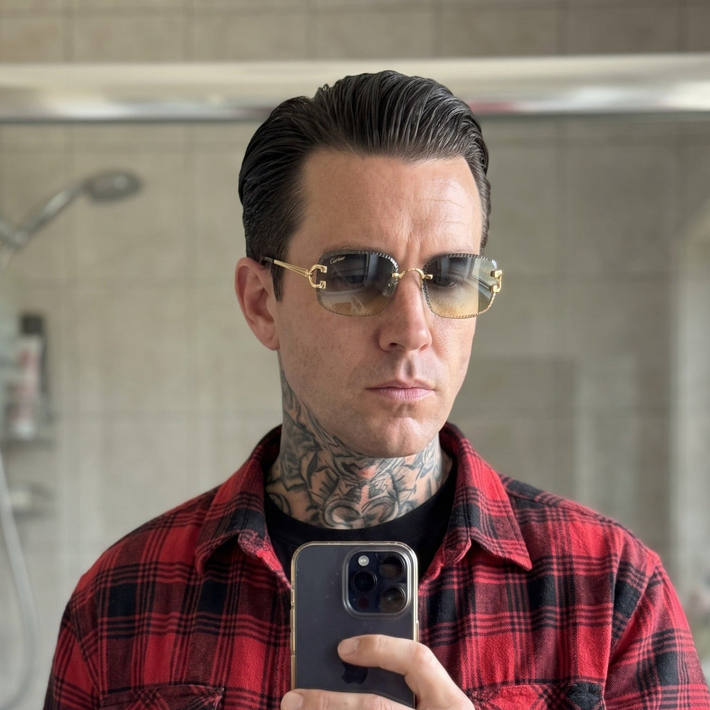 Man wearing the Diamond cut Big C Wires, blue to yellow gradient lenses, Cartier eyewear