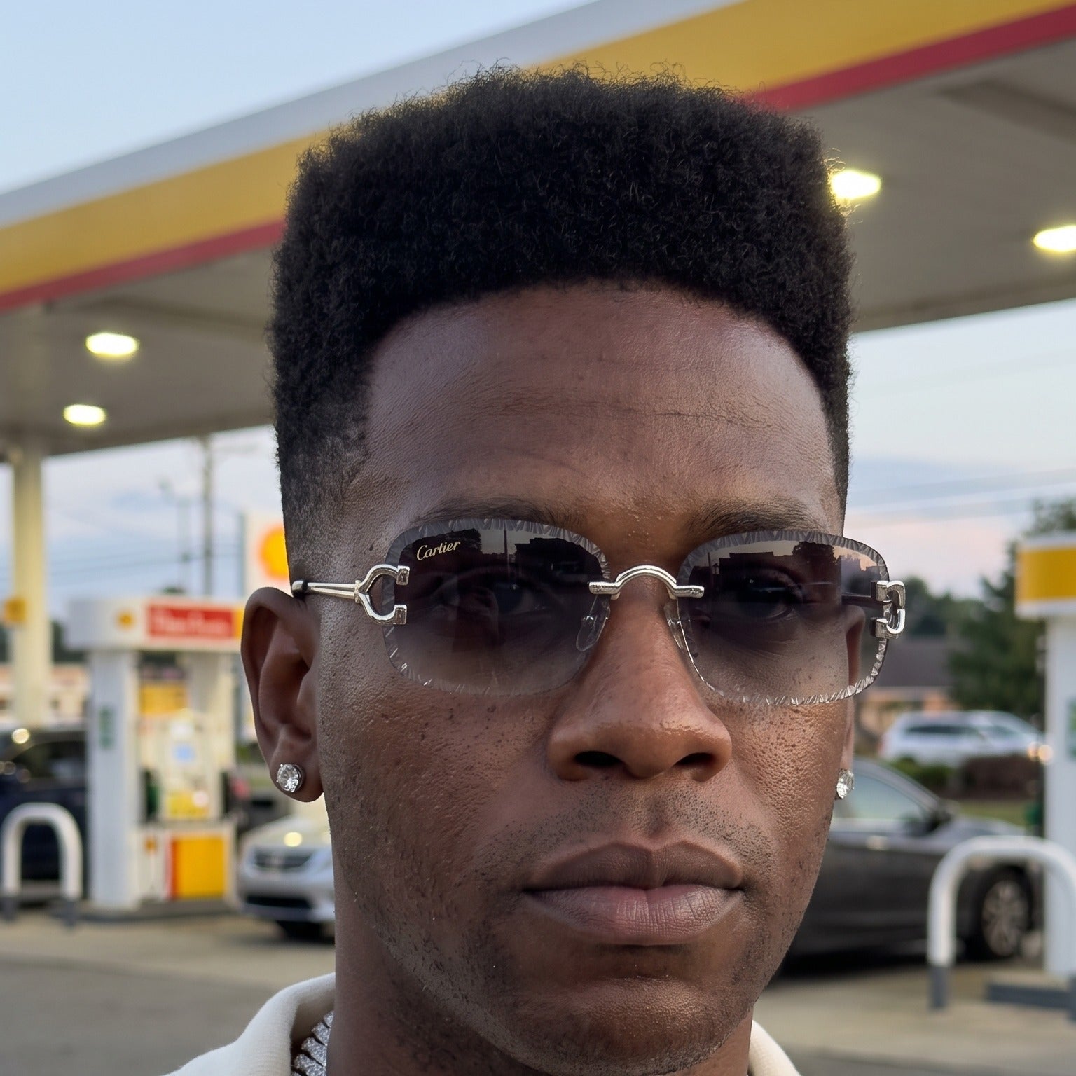 Man wearing the Diamond cut Big C Wires, grey gradient lenses, Cartier eyewear