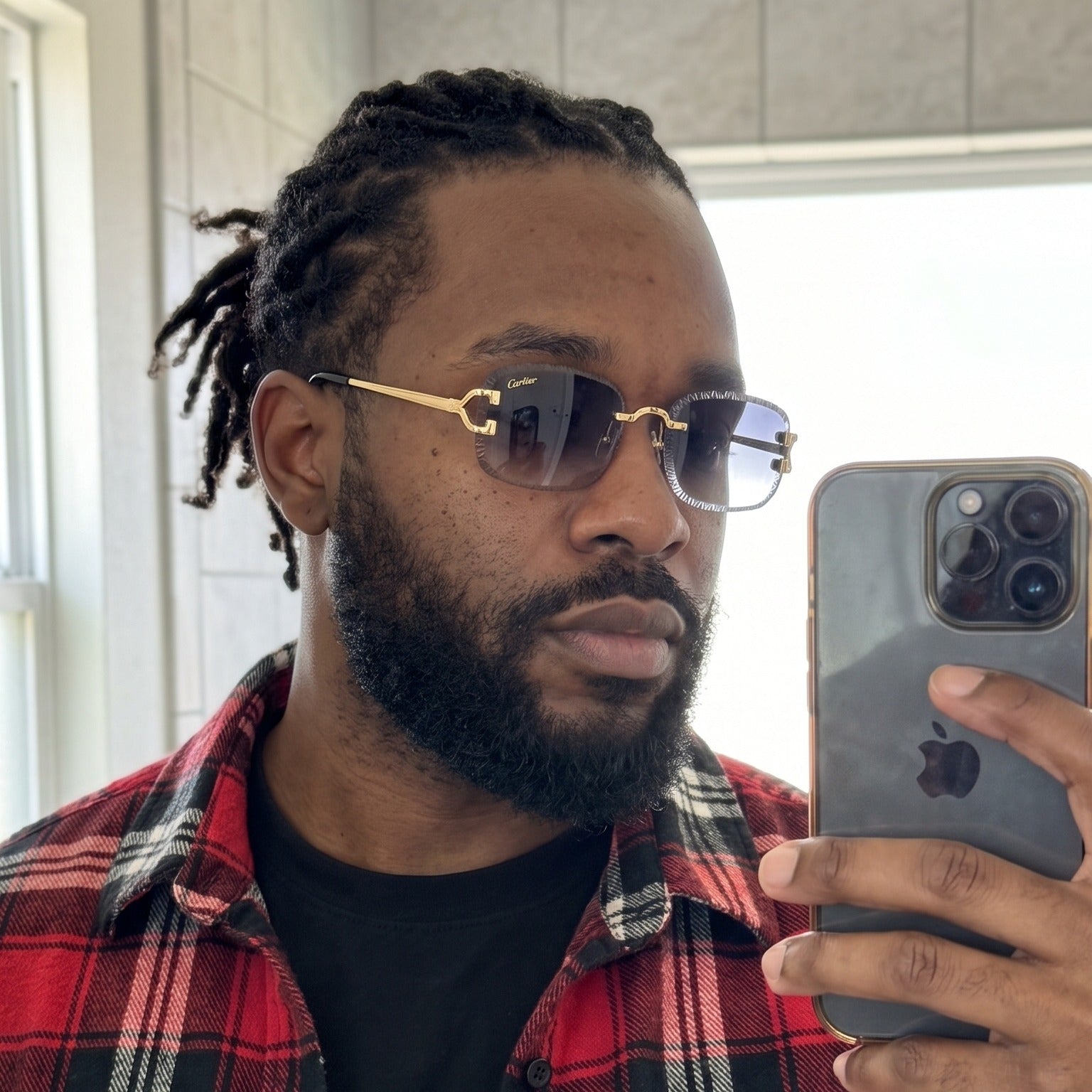 Man wearing the Diamond cut Big C Wires, grey gradient lenses, Cartier eyewear