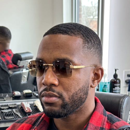 Man wearing the Big C Wires, brown gradient lenses, Cartier eyewear