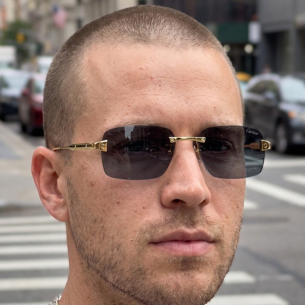 Man wearing the Big C Wires, solid grey lenses, Cartier eyewear