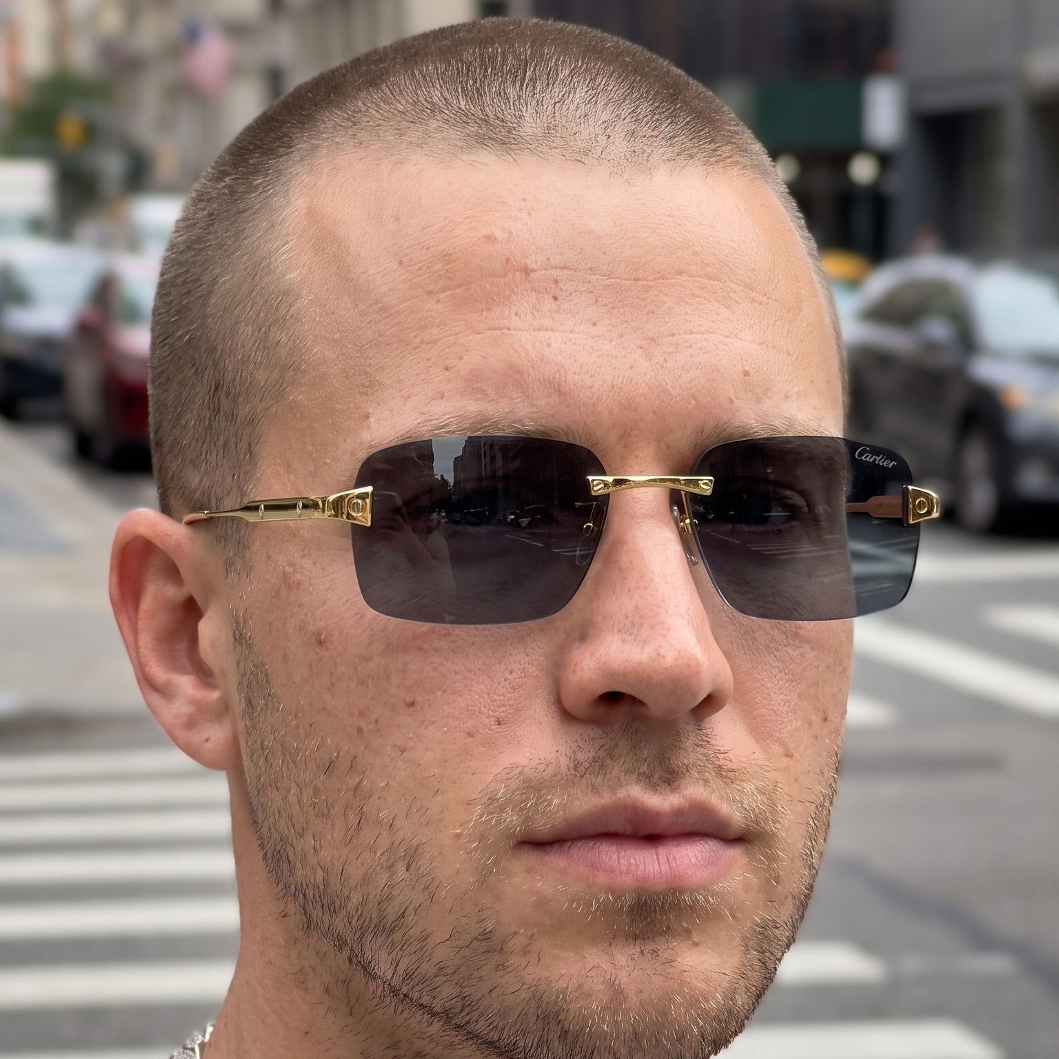 Man wearing the Big C Wires, solid grey lenses, Cartier eyewear