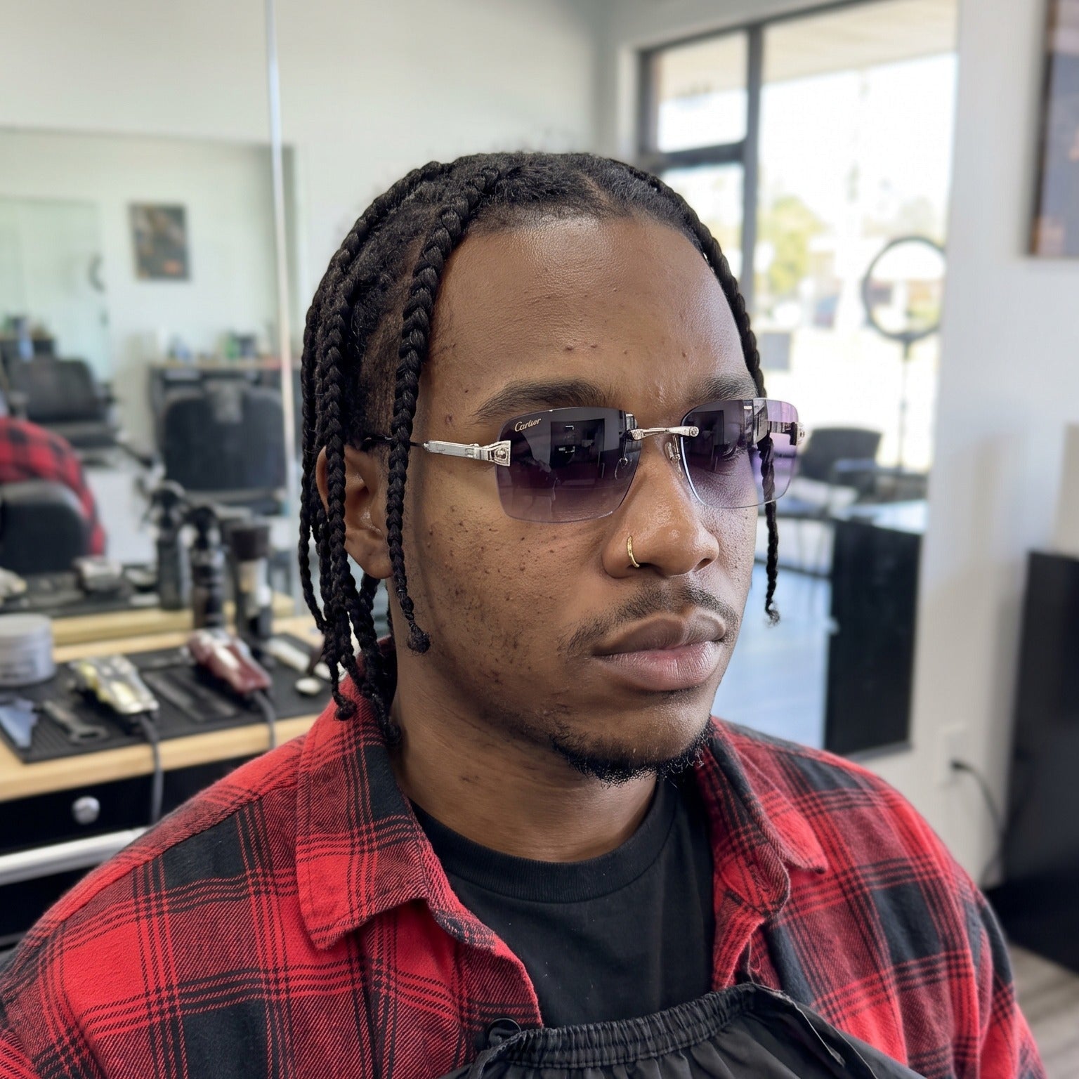 Man wearing the Big C Wire Sunglasses 60mm, purple gradient lenses, Cartier eyewear