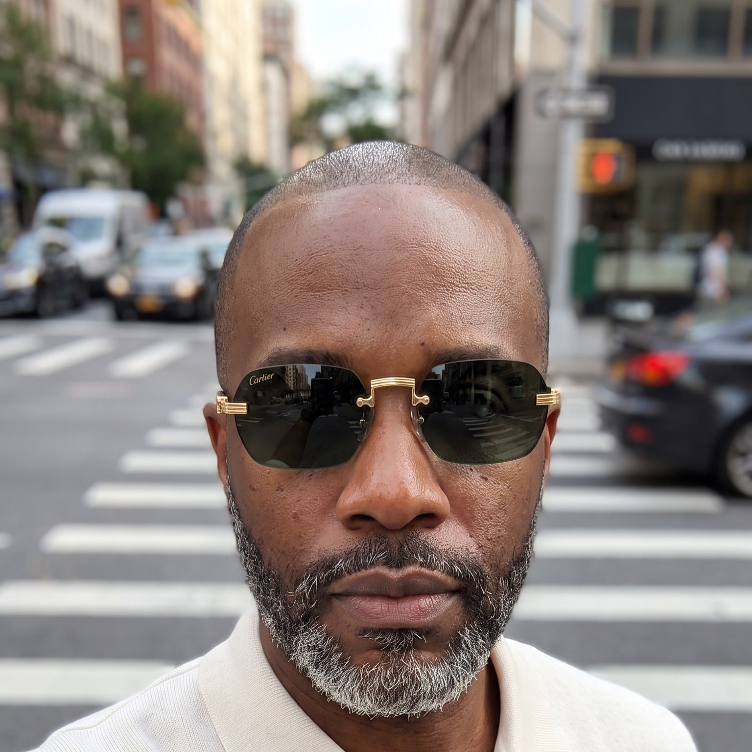 Man wearing the Rimless buffs Sunglasses Detroit style, solid green lenses, Cartier eyewear