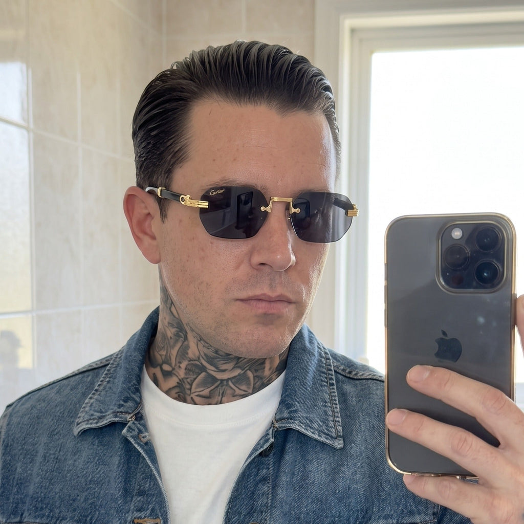 Man wearing the Rimless buffs Sunglasses Detroit style, solid grey lenses, Cartier eyewear