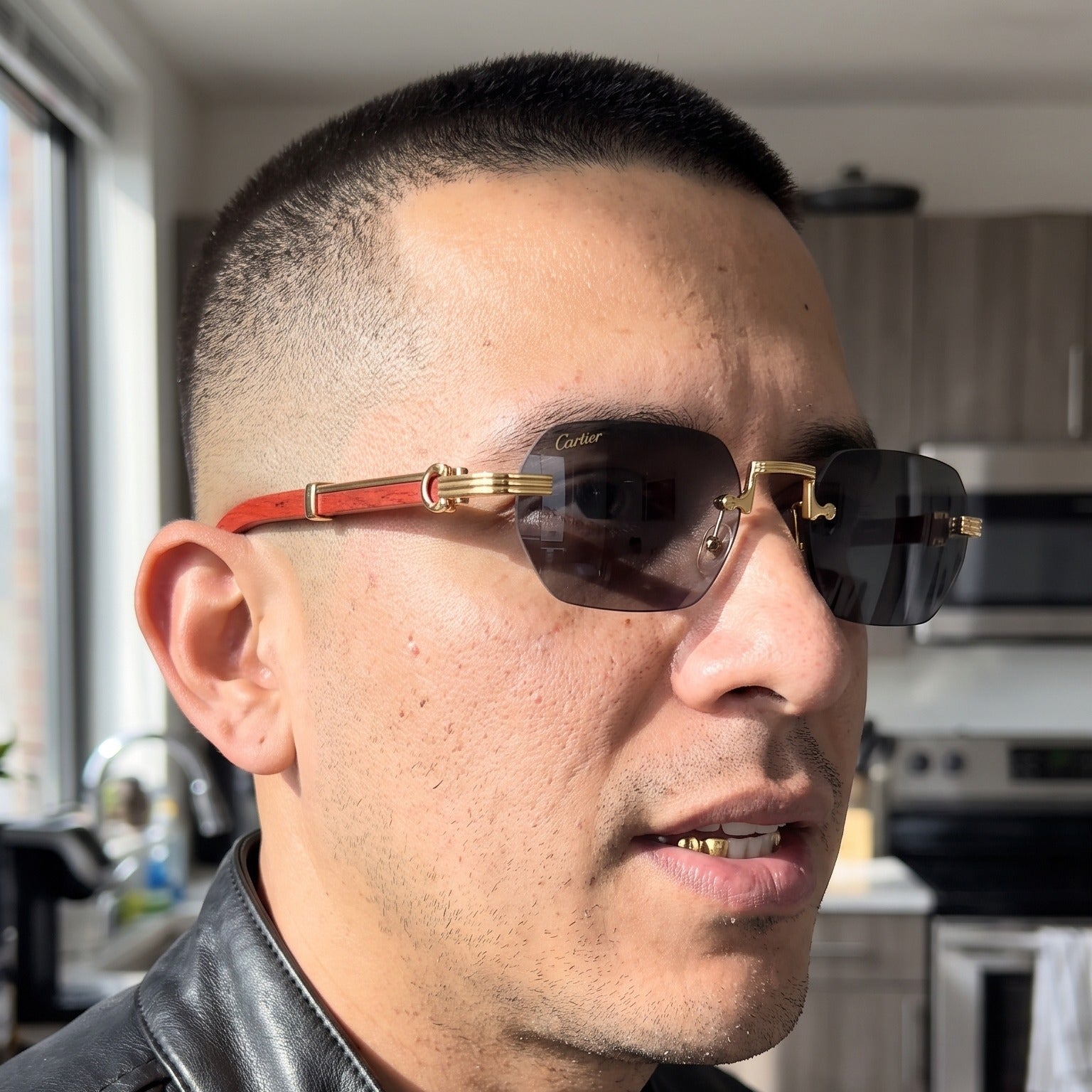 Man wearing the Rimless buffs Sunglasses Detroit style, solid grey lenses, Cartier eyewear