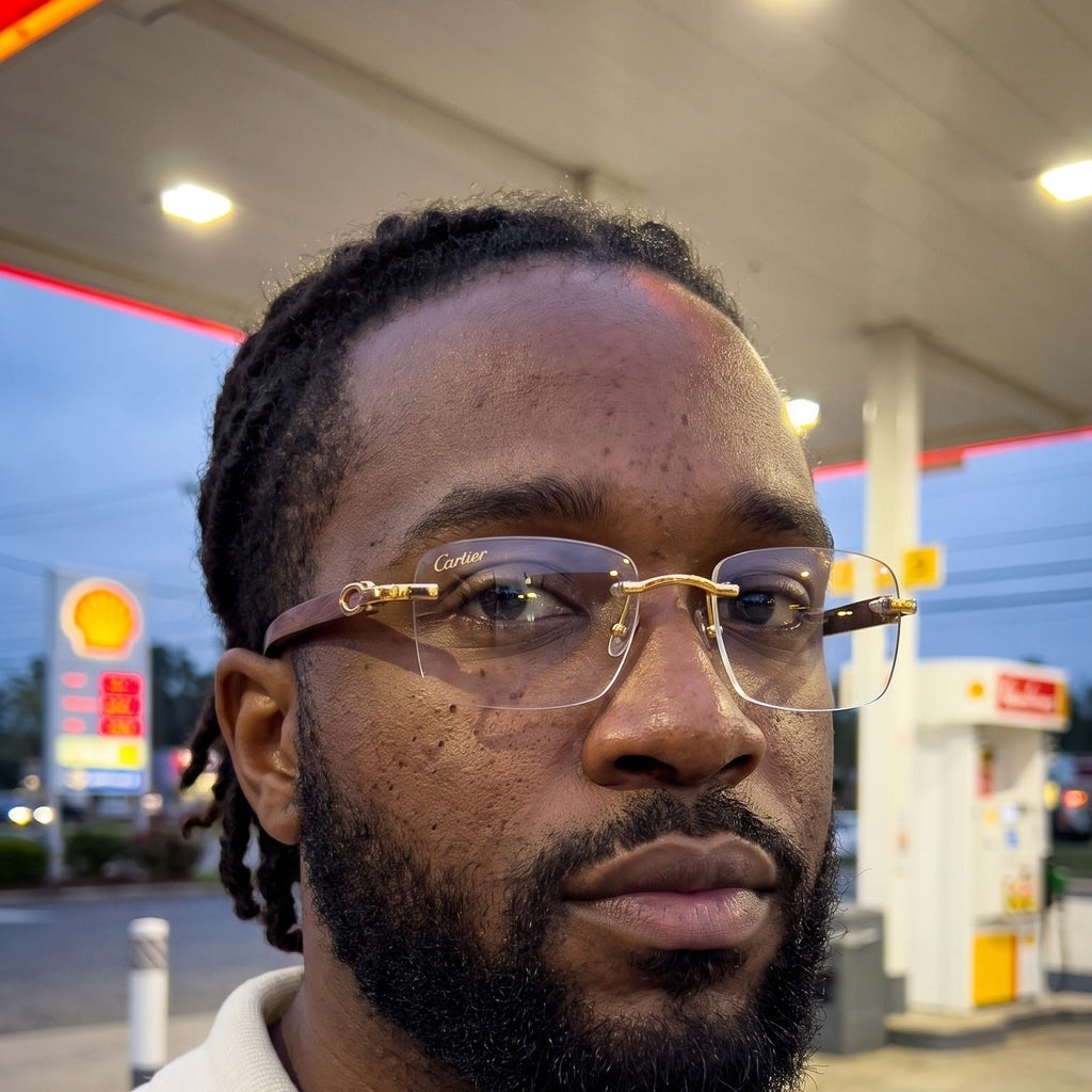 Man wearing the Rimless buffs Glasses, clear lenses, Cartier eyewear