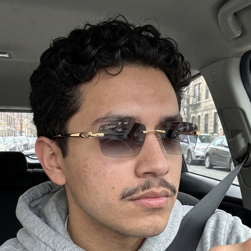 Man wearing the Big C Wires, grey gradient lenses, Cartier eyewear