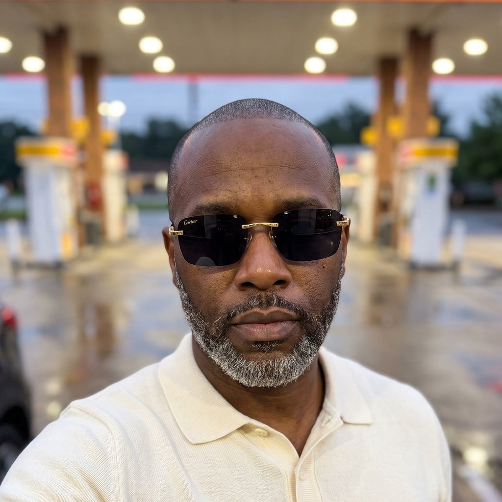Man wearing the Big C Wires, solid black lenses, Cartier eyewear