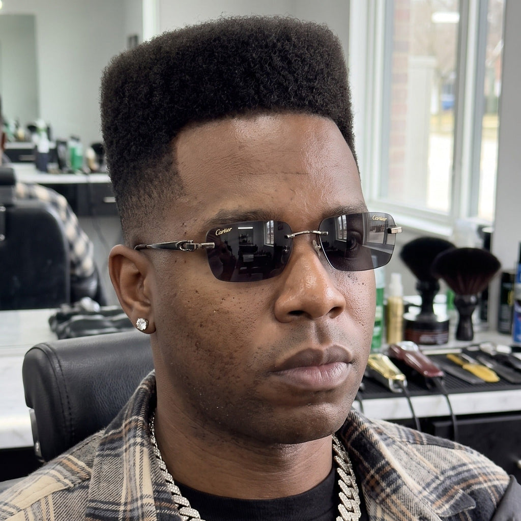 Man wearing the Big C Wires, solid grey lenses, Cartier eyewear