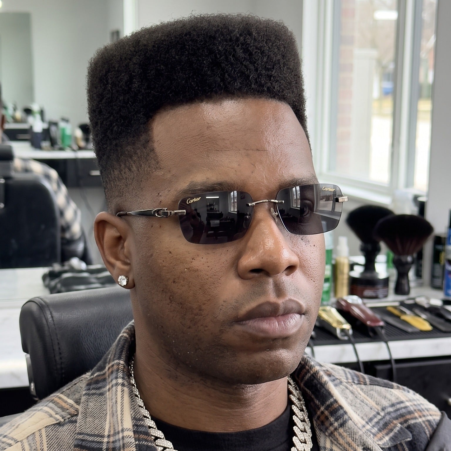 Man wearing the Big C Wires, solid grey lenses, Cartier eyewear