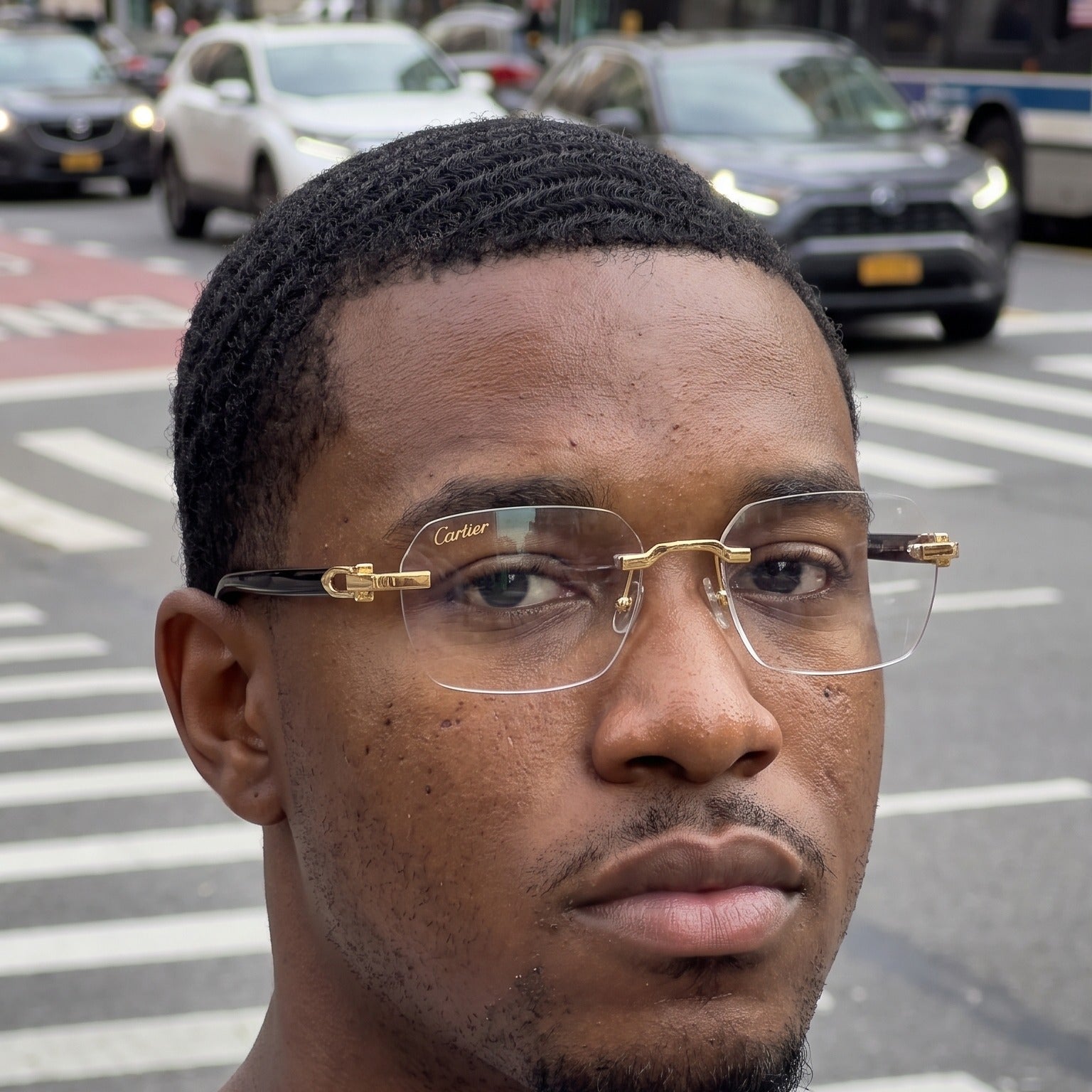 Man wearing the Rimless buffs Glasses, clear lenses, Cartier eyewear
