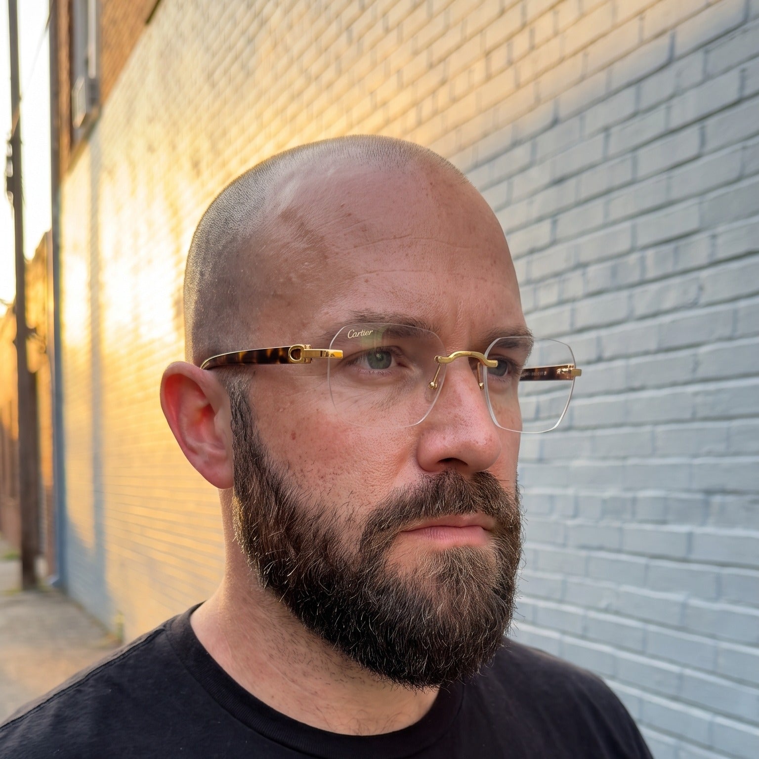 Man wearing the Rimless buffs Glasses, clear lenses, Cartier eyewear