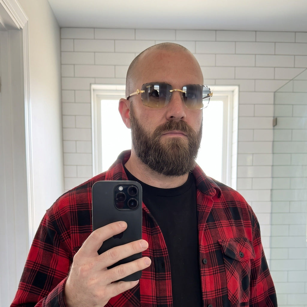 Man wearing the Diamond cut Big C Wires, grey to yellow gradient lenses, Cartier eyewear