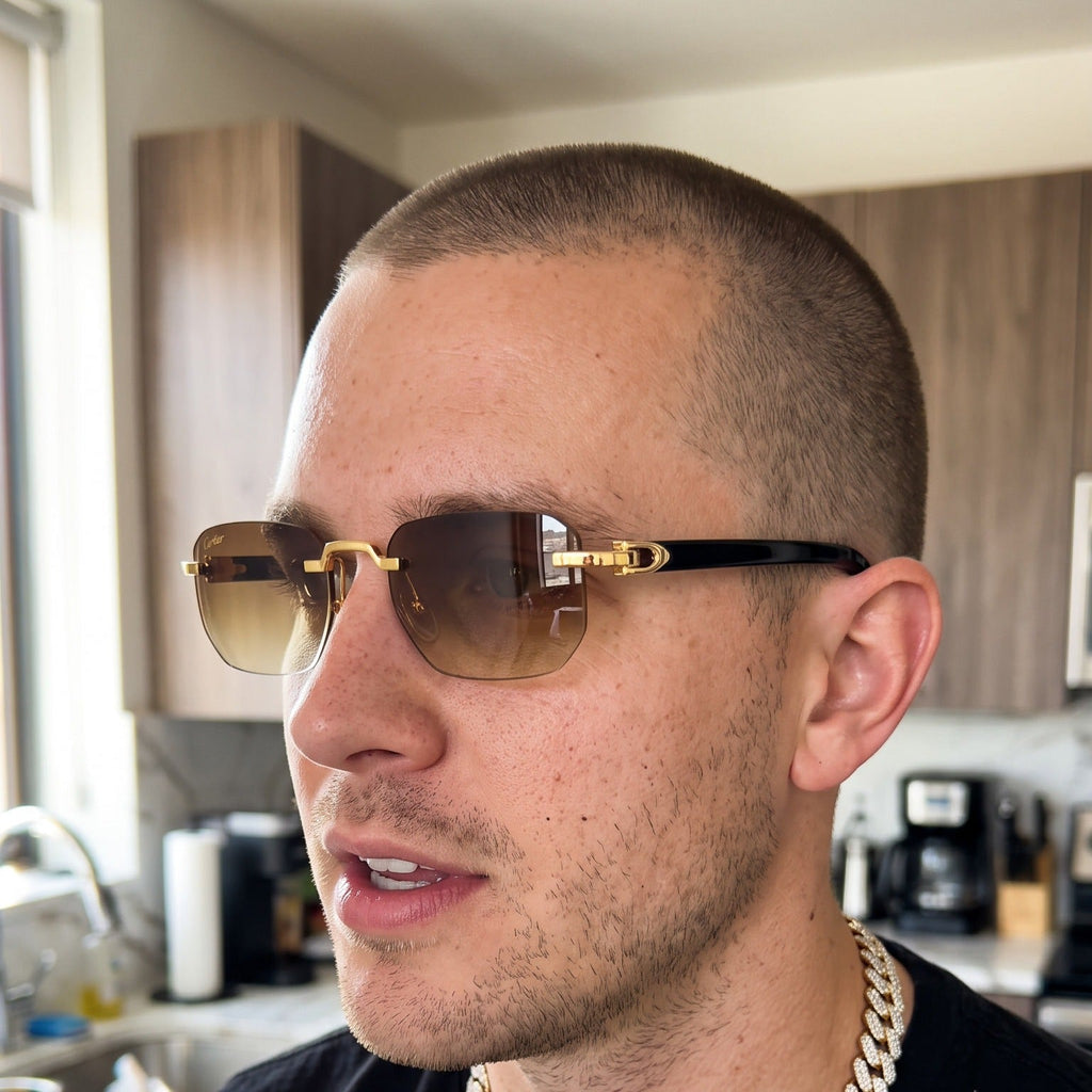 Man wearing the Rimless buffs Sunglasses, brown gradient lenses, Cartier eyewear