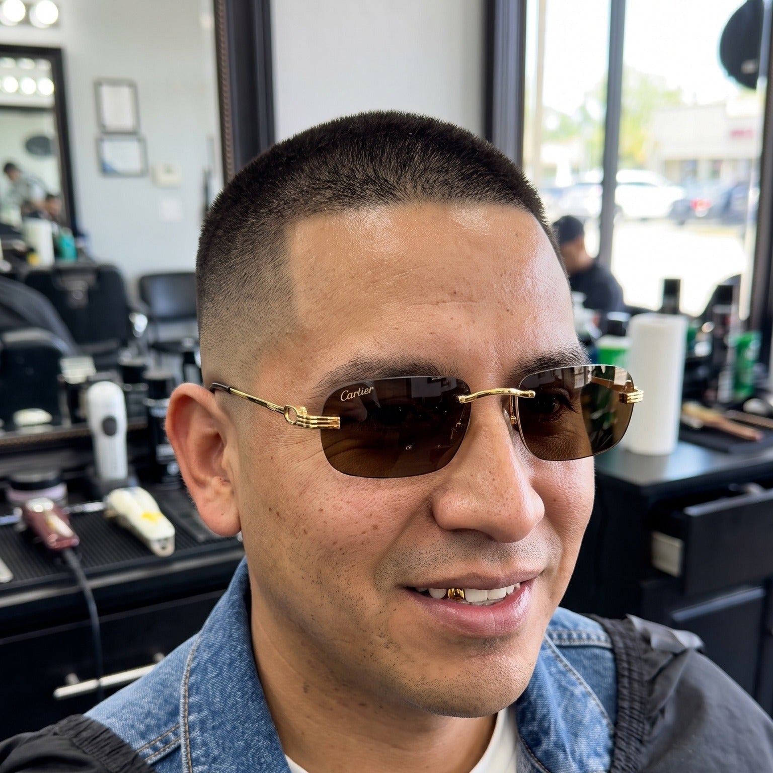 Man wearing the Big C Wires, solid brown lenses, Cartier eyewear