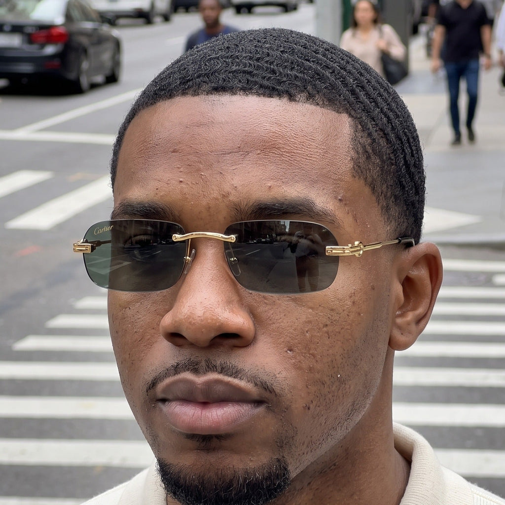 Man wearing the Big C Wires, solid grey green lenses, Cartier eyewear