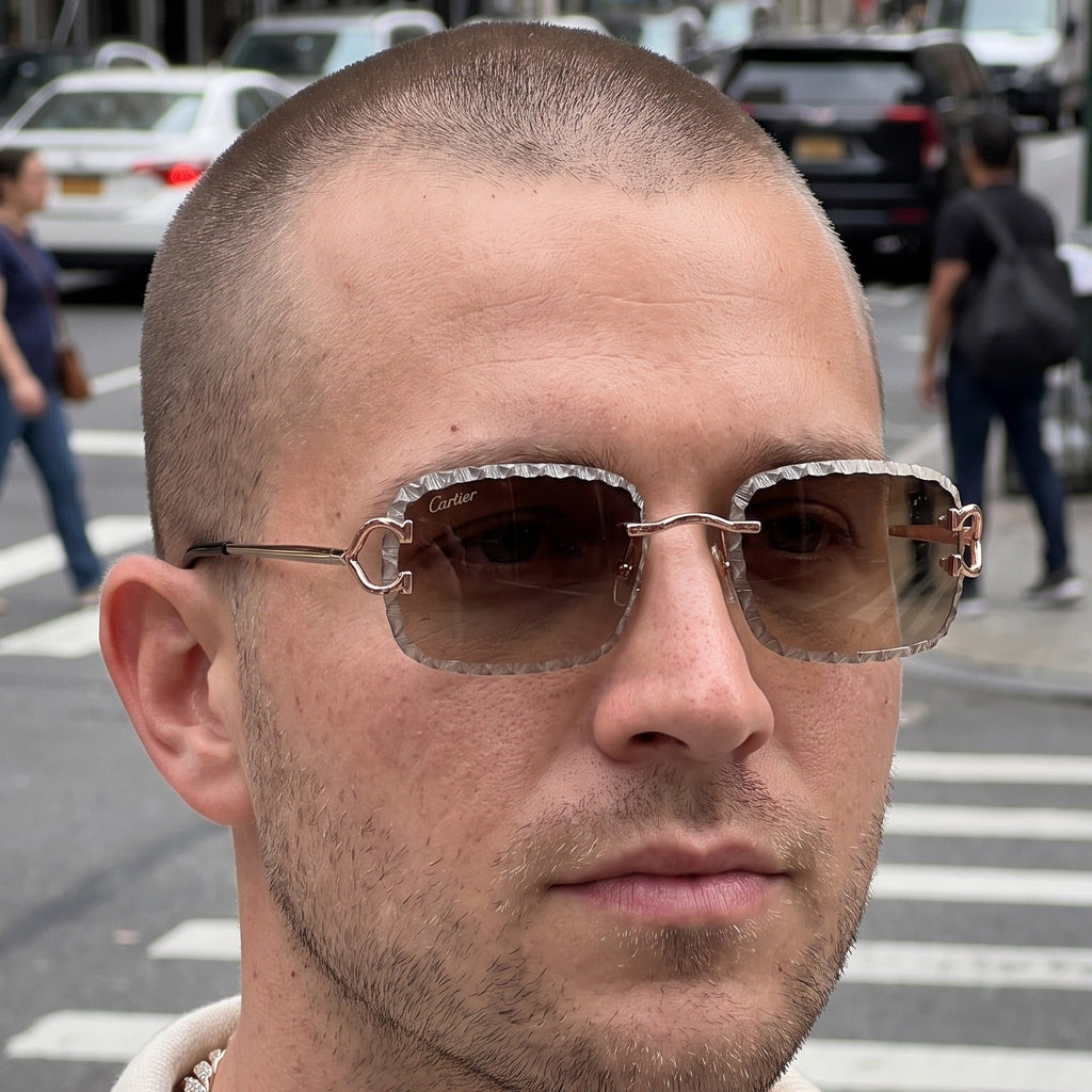 Man wearing the Iced out C wire glasses, brown gradient lenses, Cartier eyewear