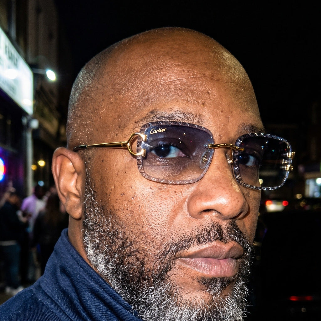 Man wearing the Iced out C wire glasses, blue gradient lenses, Cartier eyewear