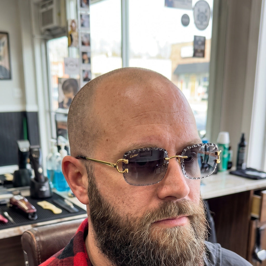Man wearing the Iced out C wire glasses, grey gradient lenses, Cartier eyewear